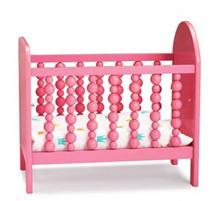 Bild Spjälsäng i trä, rosa