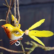 Bild Fågel med snurrad fjäder Gul