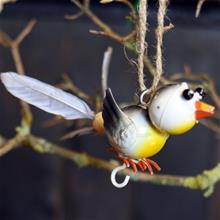 Bild Fågel med snurrad fjäder Grå/Gul